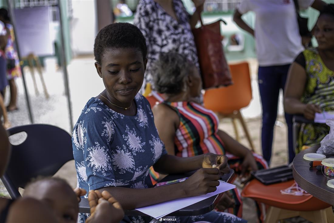 A participant working at a table during a skills workshop
