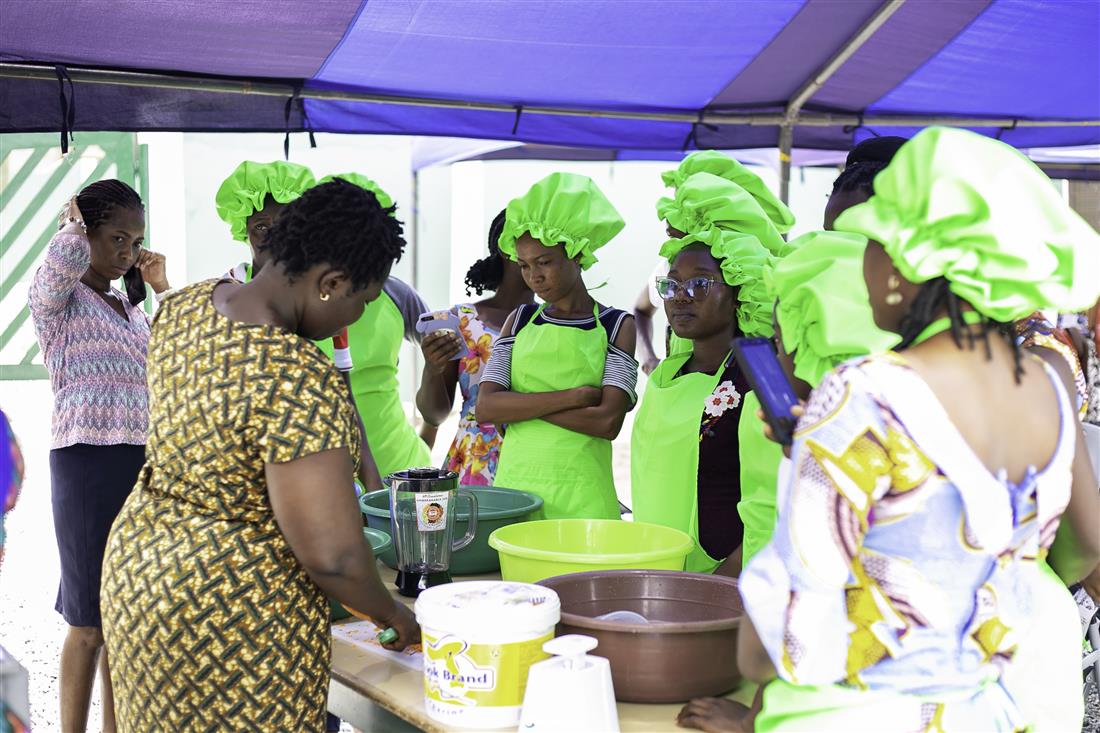 Participants gathered around a practical skills demonstration